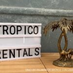 PALMERA DE BRONCE CON CAMELLOS